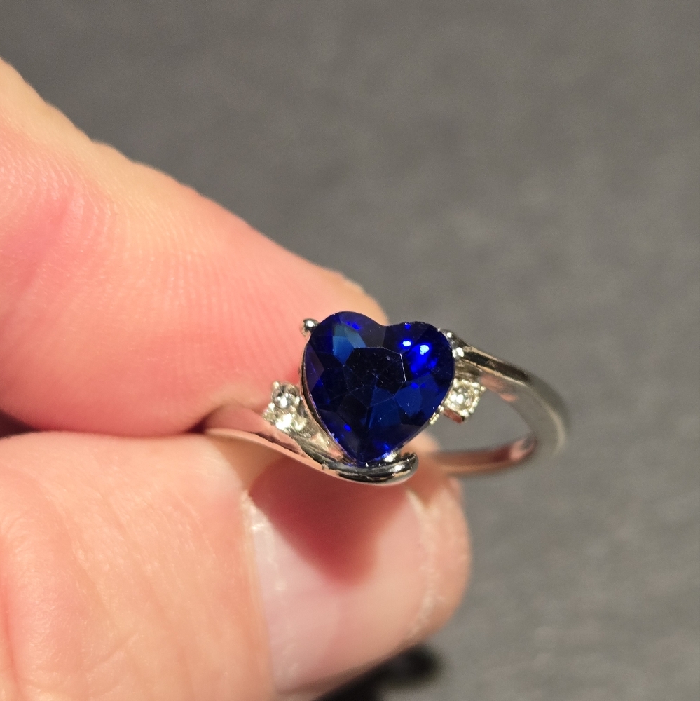 Silver ring with blue heart shaped stone with cz accents...24170